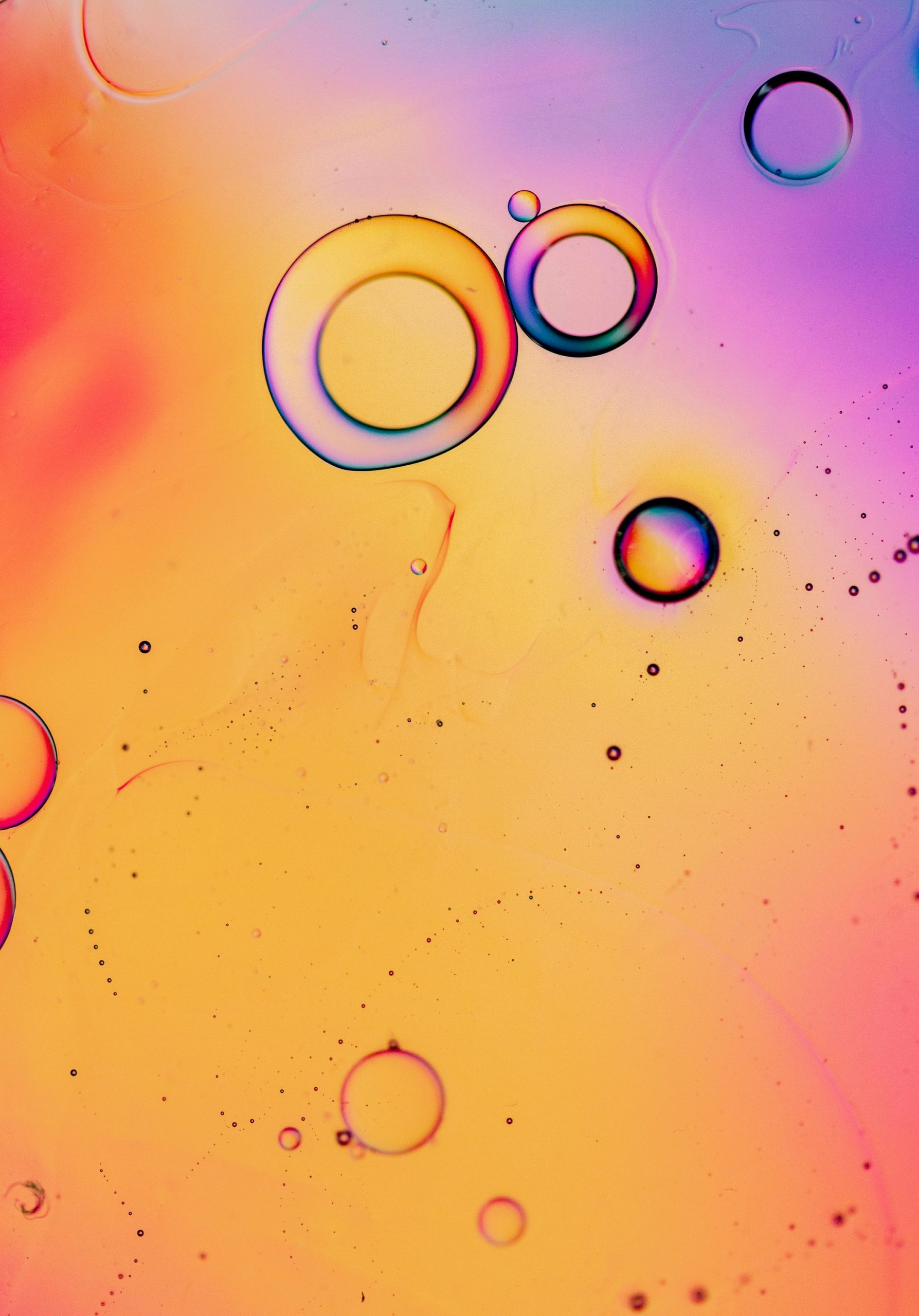 Abstract view of concentric circles forming a tunnel-like vortex in warm tones.